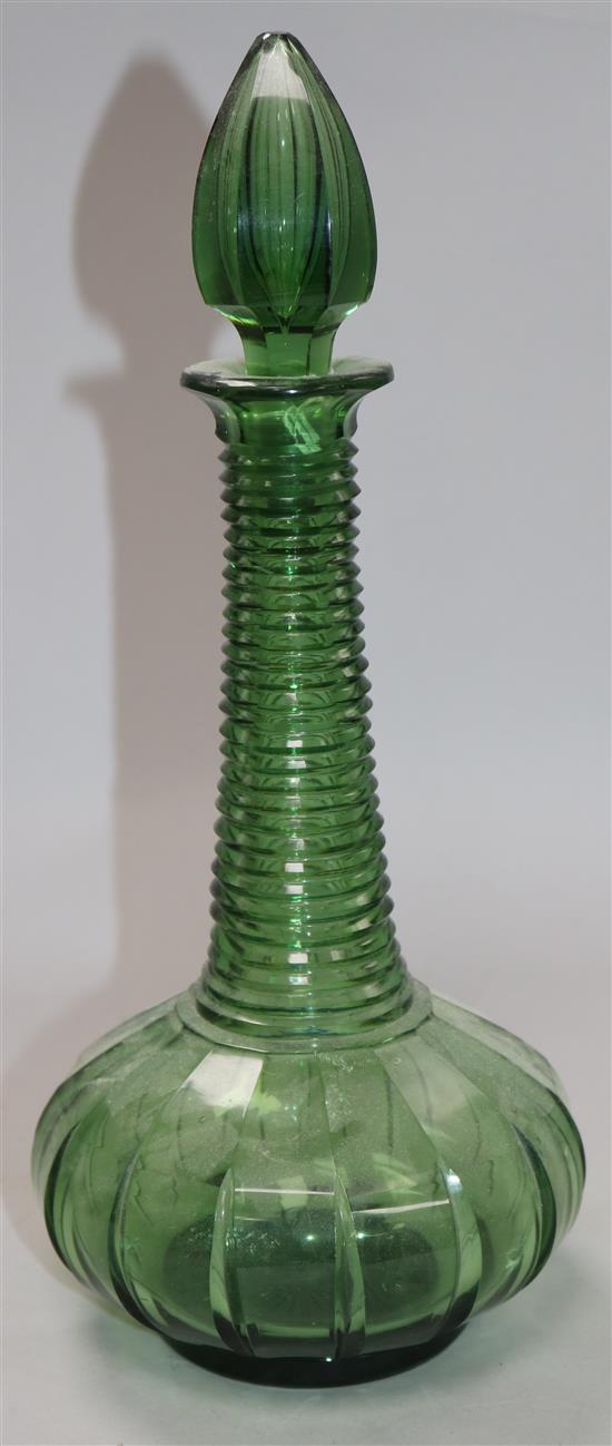 An early Victorian green glass spire decanter	 32cm